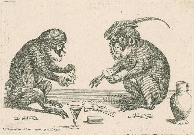Twee apen spelen een kaartspel